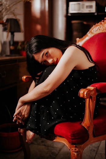 Photo Of Woman Sitting On Chair