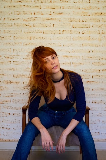 Photo of Woman Sitting on Chair