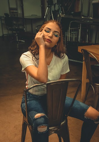 Photo of Woman Sitting on Chair