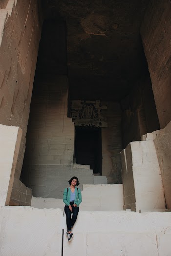 Photo of Woman Sitting on Concrete Blocks