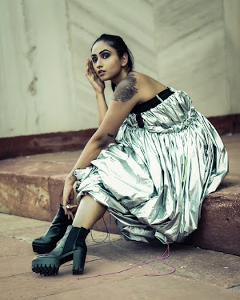 Photo Of Woman Sitting On Concrete Platform