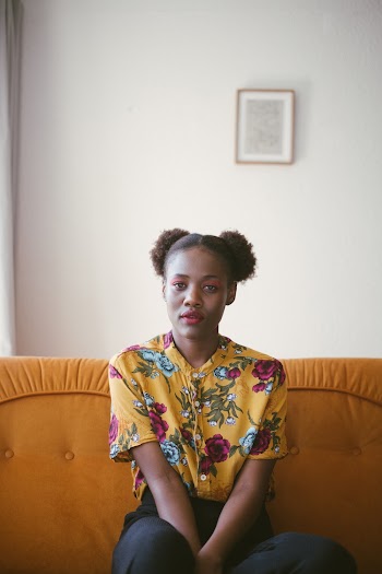 Photo Of Woman Sitting On Couch