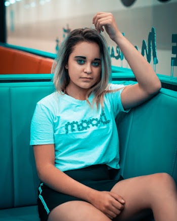 Photo of Woman Sitting On Couch