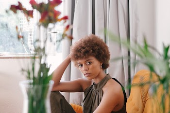 Photo Of Woman Sitting On Couch