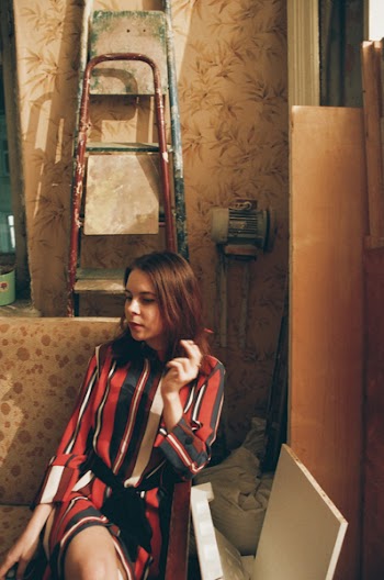 Photo of Woman Sitting On Couch