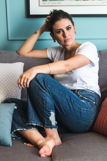 Photo of Woman Sitting On Couch