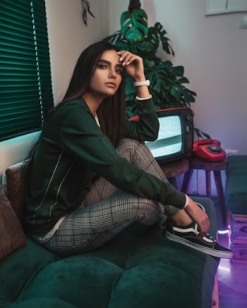Photo of Woman Sitting on Couch