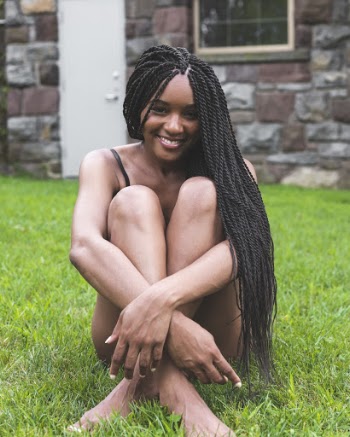 Photo of Woman Sitting on Grass
