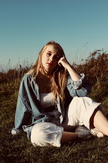 Photo of Woman Sitting on Grass