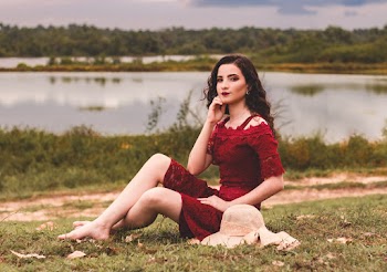 Photo Of Woman Sitting On Grass