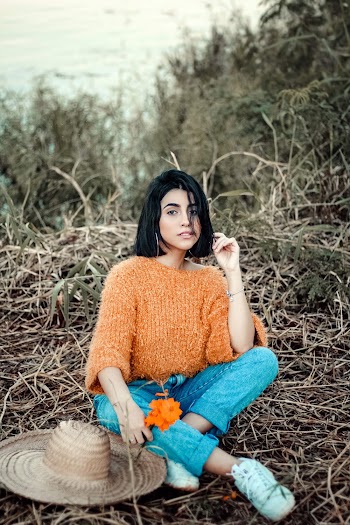 Photo Of Woman Sitting On Ground