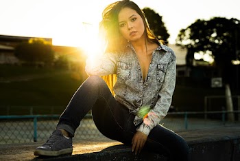 Photo of Woman Sitting On Ledge