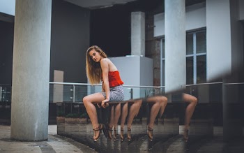 Photo of Woman Sitting On Ledge