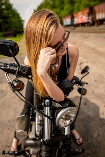 Photo Of Woman Sitting On Motorcycle