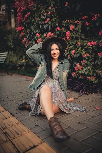 Photo of Woman Sitting On Pavement
