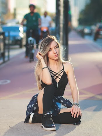 Photo of Woman Sitting on Pavement
