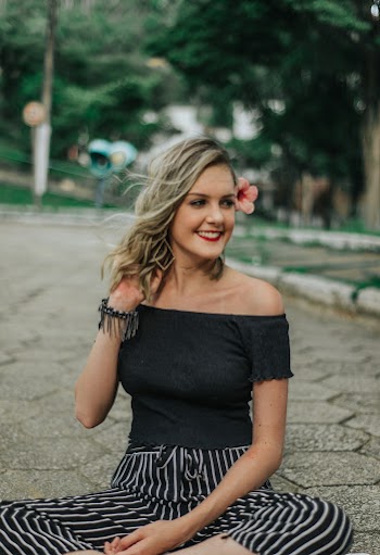 Photo of Woman Sitting On Pavement