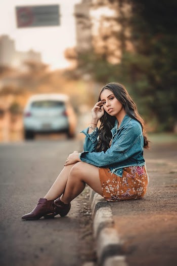 Photo of Woman Sitting On Pavement