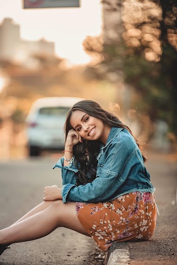 Photo of Woman Sitting On Pavement