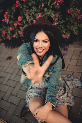 Photo of Woman Sitting On Pavement