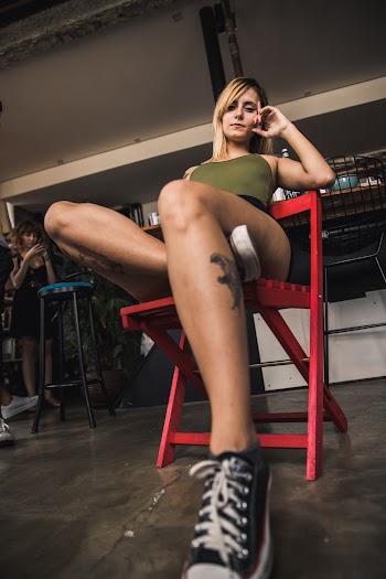 Photo of Woman Sitting On Red Chair