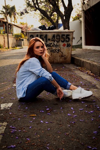 Photo Of Woman Sitting On Road