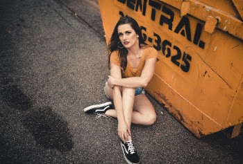 Photo of Woman Sitting on Road