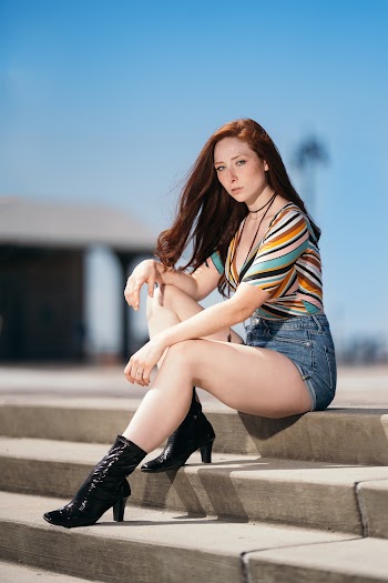 Photo Of Woman Sitting On Staircase
