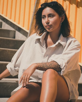 Photo Of Woman Sitting On Stairs