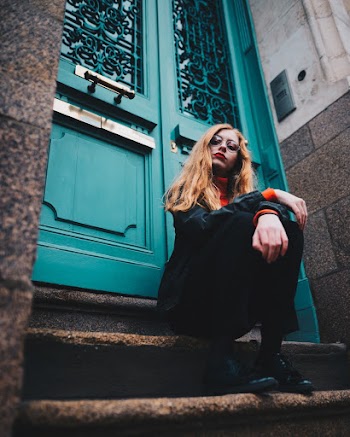 Photo of Woman Sitting On Stairs