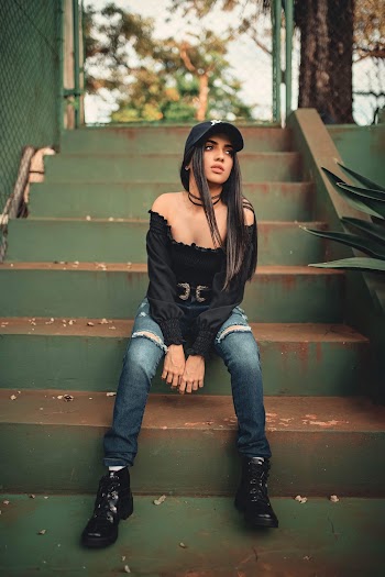 Photo Of Woman Sitting On Stairs