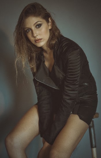 Photo of Woman Sitting on Stool