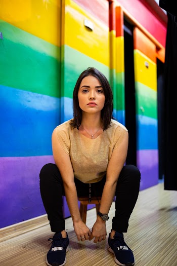Photo of Woman Sitting on Stool