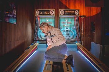 Photo of Woman Sitting on Table Game