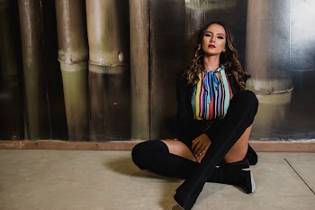 Photo of Woman Sitting on the Floor