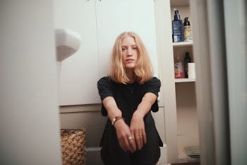 Photo Of Woman Sitting On The Floor