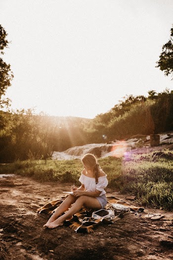 Photo Of Woman Sitting On The Ground