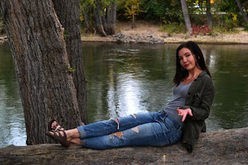 Photo of Woman Sitting On Tree Trunk