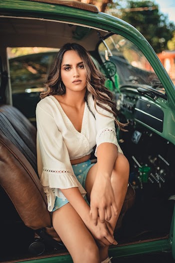 Photo Of Woman Sitting On Vehicle