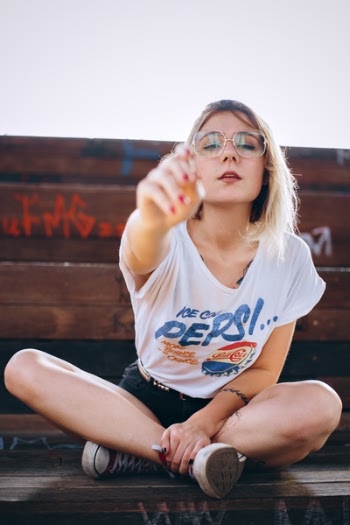 Photo of Woman Sitting on Wooden Bench