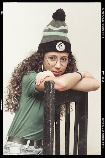 Photo Of Woman Sitting On Wooden Chair