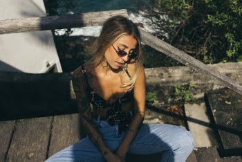 Photo of Woman Sitting on Wooden Stair