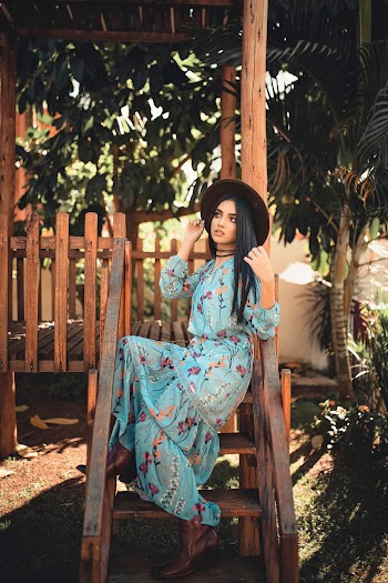 Photo of Woman Sitting on Wooden Stairs