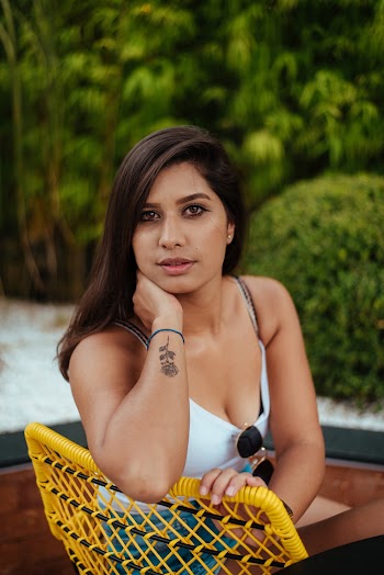 Photo of Woman Sitting On Yellow Chair