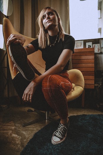 Photo of Woman Sitting On Yellow Chair