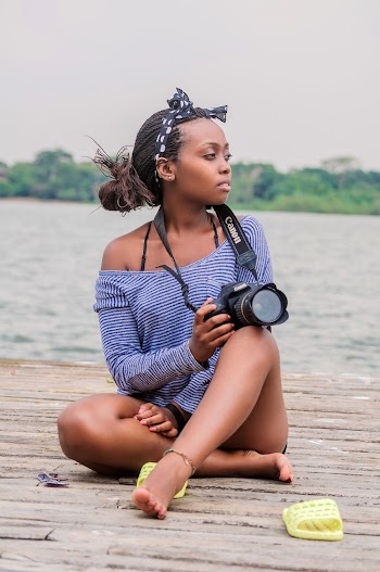 Photo Of Woman Sitting While Holding Camera