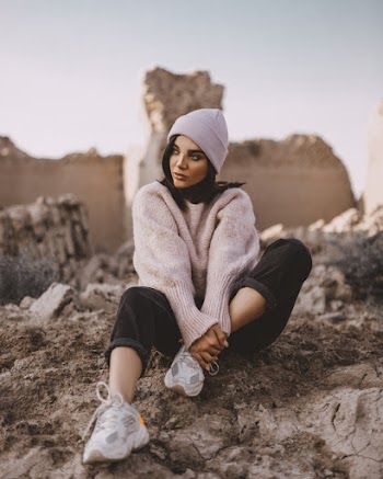 Photo of Woman Sitting While Wearing Bonnet