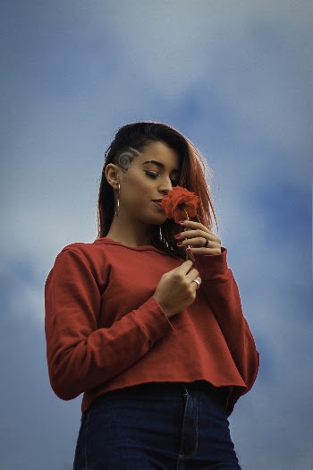 Photo of Woman Smelling Flower