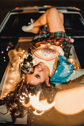 Photo of Woman Smiling While Lying Down