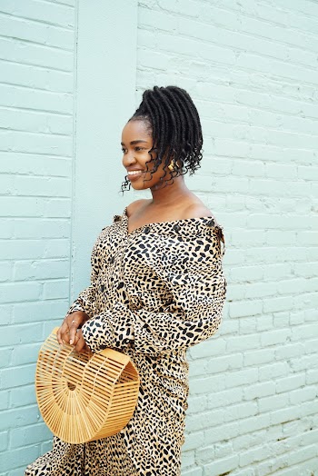Photo of Woman Smiling While Wearing Dress